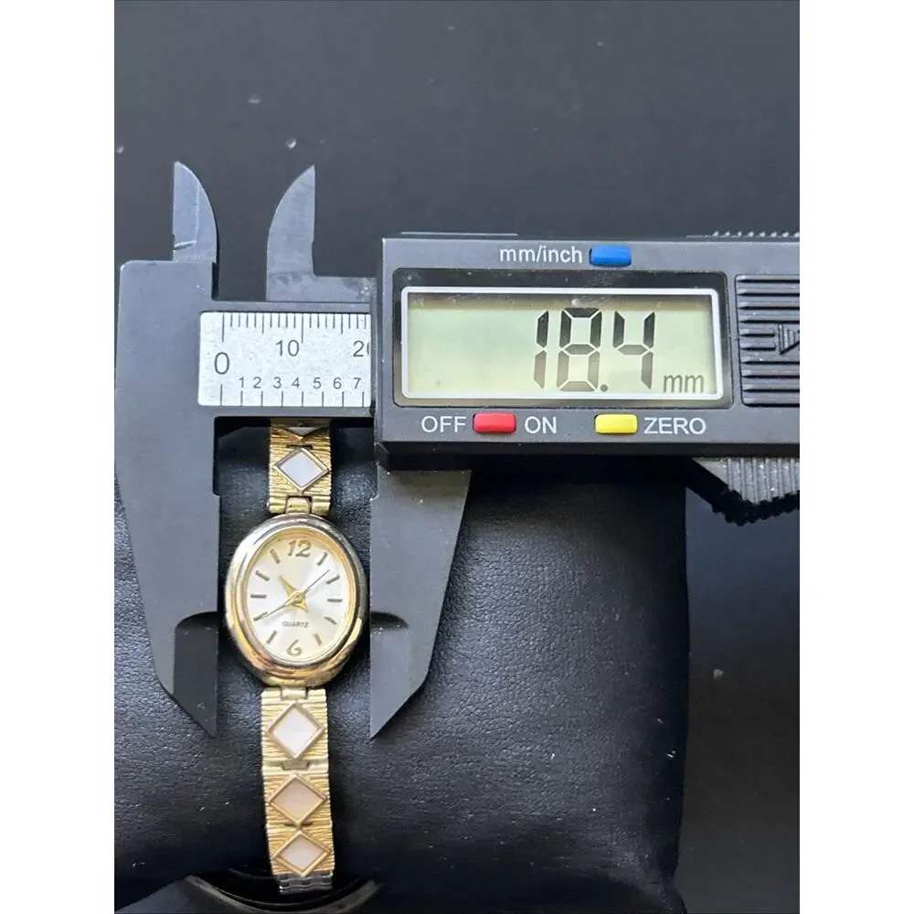 Gold Tone Oval Case Women’s Stretch Band Quartz Watch